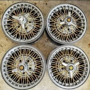 TrueSpoke 15x7 1994 GOLD AND CHROME Bold pattern:15x4.5/5x114.3 Tri-Bar jaguar lion spinners will work on some FWD Caddy's,Ford and Mopar